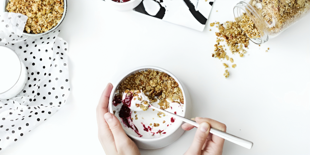 Bowl of heart-healthy oatmeal with banana, berries, and chia seeds on a breakfast table
